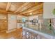 Bright and airy kitchen featuring white cabinets, hardwood floors, and breakfast bar with stool seating at 5519 Jefferies Hwy, Walterboro, SC 29488