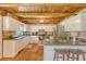 Bright kitchen with wood ceiling, white cabinets, stainless steel appliances, and breakfast bar seating at 5519 Jefferies Hwy, Walterboro, SC 29488