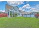 The backyard features a patio, vinyl siding, lush grass, and an above-ground pool at 575 Rosings Dr, Summerville, SC 29486