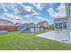 The backyard features a patio, vinyl siding, lush grass, and an above-ground pool at 575 Rosings Dr, Summerville, SC 29486
