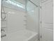 Bathroom showing a white shower over tub with a handheld shower and a tiled wall at 575 Rosings Dr, Summerville, SC 29486