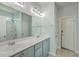 Bathroom featuring a double vanity, large mirror, modern fixtures, and shower over tub at 575 Rosings Dr, Summerville, SC 29486