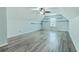 Large bedroom features gray wood-look floors, a ceiling fan, and plenty of natural light at 575 Rosings Dr, Summerville, SC 29486