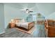 Cozy bedroom with a ceiling fan, neutral walls, and wood-look flooring at 575 Rosings Dr, Summerville, SC 29486