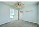 Bedroom with gray carpet, blue walls, and access to a hallway and a bonus room at 575 Rosings Dr, Summerville, SC 29486