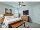 Bedroom featuring a wooden bed frame, dresser, ceiling fan, and decor elements at 575 Rosings Dr, Summerville, SC 29486