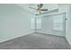 Spacious bedroom featuring plush carpeting, tray ceiling, and bright windows at 575 Rosings Dr, Summerville, SC 29486