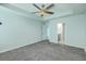 Bedroom with gray carpet, light blue walls, ceiling fan, and an en-suite bathroom at 575 Rosings Dr, Summerville, SC 29486