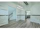 Spacious dining area with wood-look floors open to the staircase at 575 Rosings Dr, Summerville, SC 29486