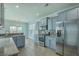 Stylish kitchen with stainless steel appliances, granite counters, and gray cabinets at 575 Rosings Dr, Summerville, SC 29486