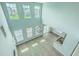 High angle view of open living area features wood floors, modern lighting, and kitchen access at 575 Rosings Dr, Summerville, SC 29486