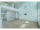 Bright, open floor plan living room with high ceilings, modern lighting, and wood flooring at 575 Rosings Dr, Summerville, SC 29486