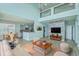 Living room with contemporary furnishings, wood floors, kitchen, and bright natural light at 575 Rosings Dr, Summerville, SC 29486