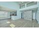 Open floor plan living room with high ceilings, recessed lighting, wood flooring, and kitchen view at 575 Rosings Dr, Summerville, SC 29486