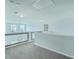 Bright loft with railing overlooking the lower level, recessed lights, and neutral walls at 575 Rosings Dr, Summerville, SC 29486