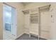 Spacious walk-in closet with built-in shelving, clothes rods, and access to bathroom at 575 Rosings Dr, Summerville, SC 29486