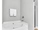 Bathroom with corner tub, neutral walls and fixtures at 622 Windermere Blvd # D, Charleston, SC 29407
