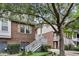 Attractive brick townhome boasting white stairs, neat landscaping, and an inviting entrance at 622 Windermere Blvd # D, Charleston, SC 29407