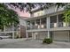 Exterior view of home shows screened porch, garage, yard and driveway at dusk at 622 Windermere Blvd # D, Charleston, SC 29407