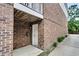 Brick exterior shot featuring a door, small porch, and a mailbox on the side of the building at 622 Windermere Blvd # D, Charleston, SC 29407