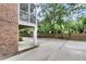 Exterior angle showcases the underside of the building's screened porch and surrounding greenery at 622 Windermere Blvd # D, Charleston, SC 29407