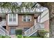Attractive brick townhome boasting white stairs, neat landscaping, and an inviting entrance at 622 Windermere Blvd # D, Charleston, SC 29407