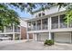 Exterior view of a home featuring a screened porch, garage, and driveway with landscaping at 622 Windermere Blvd # D, Charleston, SC 29407