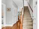 Bright entryway with hardwood floors, staircase, and natural light, creating a welcoming ambiance at 622 Windermere Blvd # D, Charleston, SC 29407
