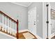 Stylish foyer featuring hardwood floors, a staircase, and neutral paint, offering a modern aesthetic at 622 Windermere Blvd # D, Charleston, SC 29407