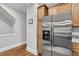 Kitchen showcasing stainless steel refrigerator and wood cabinets, offering ample storage in a modern design at 622 Windermere Blvd # D, Charleston, SC 29407