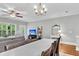 Bright living area with hardwood floors features open access to the dining room and plenty of natural light at 622 Windermere Blvd # D, Charleston, SC 29407
