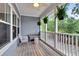 Charming porch features a ceiling fan and hanging ferns for outdoor relaxation at 622 Windermere Blvd # D, Charleston, SC 29407