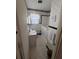 Cozy bathroom featuring a walk-in tub, checkered floors, and a charming window at 686 W Pine St, Varnville, SC 29944