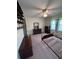 Bedroom with ceiling fan and light blue curtains at 686 W Pine St, Varnville, SC 29944