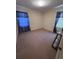 Neutral bedroom with blue curtains and a neutral carpet at 686 W Pine St, Varnville, SC 29944