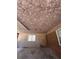 Open garage featuring brick walls and a plywood ceiling at 686 W Pine St, Varnville, SC 29944