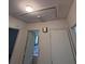 Hallway with access to other rooms and access to attic at 686 W Pine St, Varnville, SC 29944