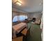 Spacious living room with vintage decor and plush green carpet at 686 W Pine St, Varnville, SC 29944