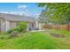 Lush backyard with green grass and a patio, perfect for entertaining or relaxing at 7300 Suncatcher Dr, Hanahan, SC 29410