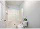 White bathroom features a shower/tub, white toilet, and a bright ceiling light at 7300 Suncatcher Dr, Hanahan, SC 29410
