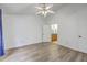 Bright bedroom featuring a ceiling fan, light gray floors, and ensuite bathroom at 7300 Suncatcher Dr, Hanahan, SC 29410