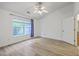 Spacious bedroom featuring a ceiling fan, light gray floors, and bright natural light at 7300 Suncatcher Dr, Hanahan, SC 29410