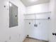 Utility room with washer hookup, open wire shelving, and concrete flooring at 7300 Suncatcher Dr, Hanahan, SC 29410