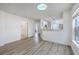 Bright living area with skylight, modern floors, open to the adjacent kitchen at 7300 Suncatcher Dr, Hanahan, SC 29410