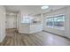 Spacious living area with modern flooring, open to the kitchen, and lots of light at 7300 Suncatcher Dr, Hanahan, SC 29410