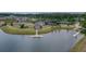 Aerial view showcasing lake, dock, and community amenities like tennis courts and walking paths at 105 Harbor Trace Ln, Summerville, SC 29486