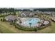 Overhead shot of community pool, palm trees and recreational facilities in a lush green setting at 105 Harbor Trace Ln, Summerville, SC 29486