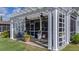 Backyard view featuring a screened-in patio with an overhead pergola at 105 Harbor Trace Ln, Summerville, SC 29486