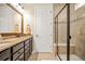 Well-lit bathroom with granite countertops, dark wood cabinets and a tiled shower at 105 Harbor Trace Ln, Summerville, SC 29486