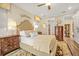 Cozy bedroom with neutral tones, wooden furniture, and a large patterned rug at 105 Harbor Trace Ln, Summerville, SC 29486